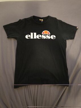 Ellesse Black Tee with White Logo and Orange Accent